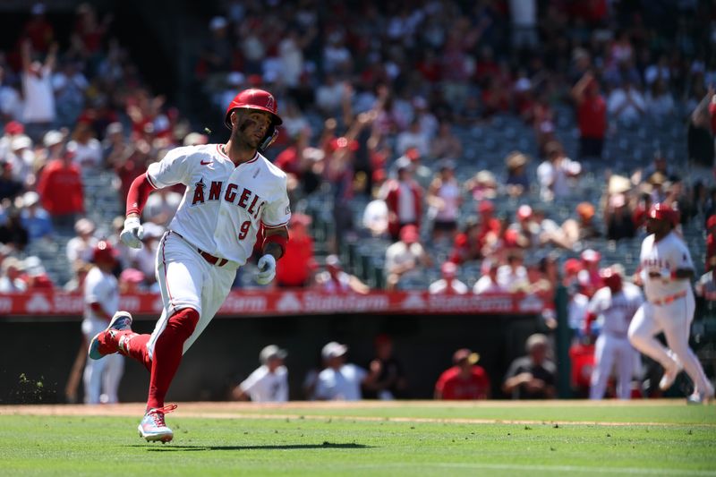 Jun 26, 2024; Anaheim, California, USA;  Los Angeles Angels shortstop Zach Neto (9) hits an RBI double against the Oakland Athletics during the sixth inning at Angel Stadium. Mandatory Credit: Kiyoshi Mio-USA TODAY Sports