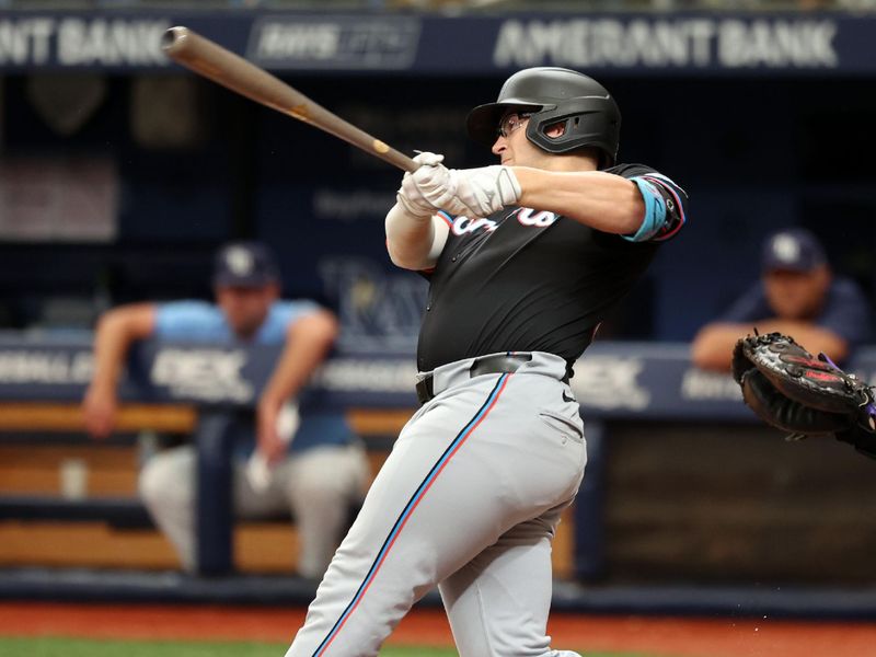 Jul 31, 2024; St. Petersburg, Florida, USA; Miami Marlins third baseman Jonah Bride (41) hits a home run against the Tampa Bay Rays during the second inning at Tropicana Field. Mandatory Credit: Kim Klement Neitzel-USA TODAY Sports