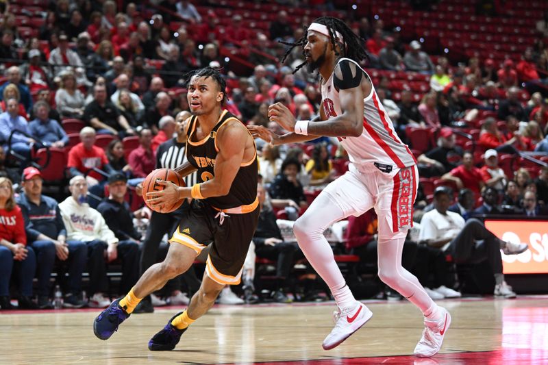 Feb 3, 2024; Las Vegas, Nevada, USA; Wyoming Cowboys guard Sam Griffin (3) drives past UNLV Rebels forward Keylan Boone (20) in the second half at Thomas & Mack Center. Mandatory Credit: Candice Ward-USA TODAY Sports