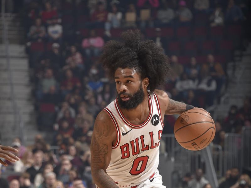 CLEVELAND, OH - FEBRUARY 14: Coby White #0 of the Chicago Bulls handles the ball during the game against the Cleveland Cavaliers on February 14, 2024 at Rocket Mortgage FieldHouse in Cleveland, Ohio. NOTE TO USER: User expressly acknowledges and agrees that, by downloading and/or using this Photograph, user is consenting to the terms and conditions of the Getty Images License Agreement. Mandatory Copyright Notice: Copyright 2024 NBAE (Photo by David Liam Kyle/NBAE via Getty Images)