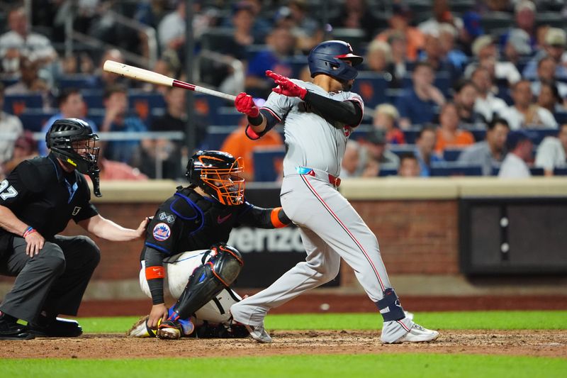 Jul 10, 2024; New York City, New York, USA; Washington Nationals second baseman Luis Garcia Jr. (2) hits a double against the New York Mets during the eighth inning at Citi Field. Mandatory Credit: Gregory Fisher-USA TODAY Sports