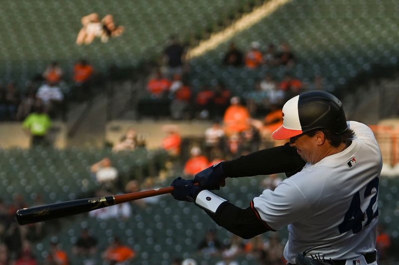 Apr 15, 2024; Baltimore, Maryland, USA; Baltimore Orioles catcher Adley Rutschman singles during the first inning against the Minnesota Twins  at Oriole Park at Camden Yards. Mandatory Credit: Tommy Gilligan-USA TODAY Sports