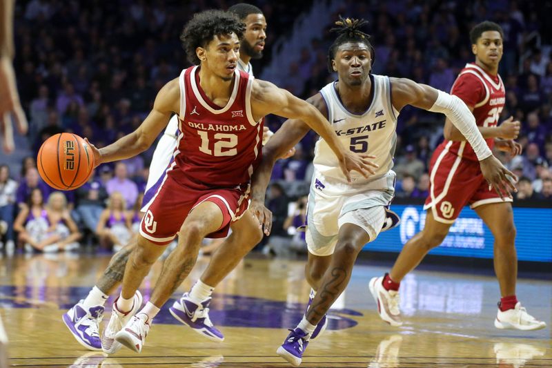 Mar 1, 2023; Manhattan, Kansas, USA; Kansas State Wildcats guard Anthony Thomas (12) dribbles by Kansas State Wildcats guard Cam Carter (5) during the second half at Bramlage Coliseum. Mandatory Credit: Scott Sewell-USA TODAY Sports