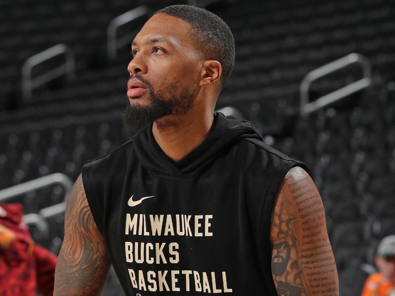 MILWAUKEE, WI - JANUARY 13: Damian Lillard #0 of the Milwaukee Bucks warms up before the game against the Golden State Warriors on January 13, 2024 at the Fiserv Forum Center in Milwaukee, Wisconsin. NOTE TO USER: User expressly acknowledges and agrees that, by downloading and or using this Photograph, user is consenting to the terms and conditions of the Getty Images License Agreement. Mandatory Copyright Notice: Copyright 2024 NBAE (Photo by Gary Dineen/NBAE via Getty Images).