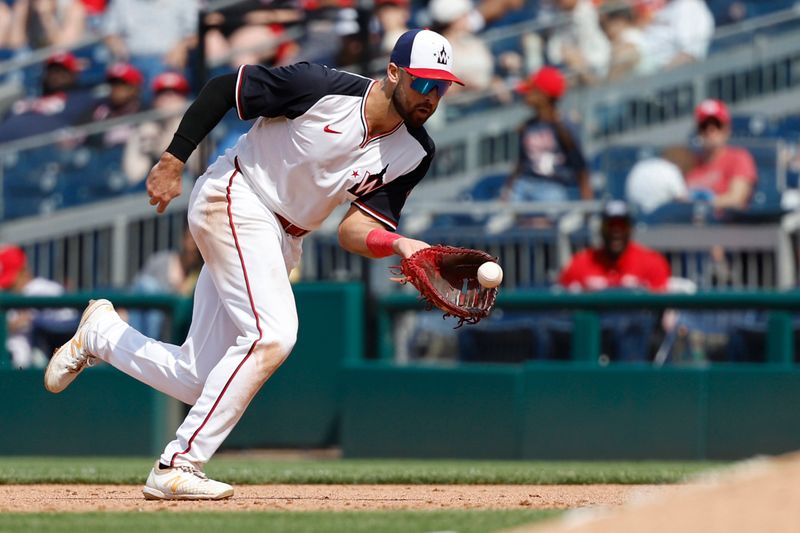 Jun 9, 2024; Washington, District of Columbia, USA; Atlanta Braves left fielder Jarred Kelenic (24) fields a ground ball by Atlanta Braves center fielder Michael Harris II (not pictured) during the sixth inning at Nationals Park. Mandatory Credit: Geoff Burke-USA TODAY Sports