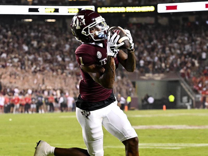 Sep 2, 2023; College Station, Texas, USA; Texas A&M Aggies wide receiver Evan Stewart (1) catches a pass and runs it in for a touchdown during the third quarter New Mexico Lobos at Kyle Field. Mandatory Credit: Maria Lysaker-USA TODAY Sports