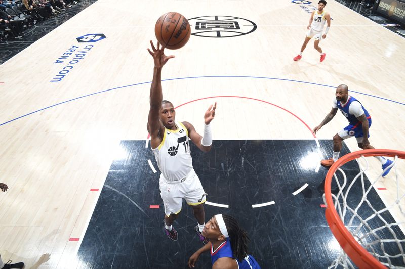 LOS ANGELES, CA - APRIL 5:  Kris Dunn #11 of the Utah Jazz goes to the basket during the game on April 5, 2024 at Crypto.Com Arena in Los Angeles, California. NOTE TO USER: User expressly acknowledges and agrees that, by downloading and/or using this Photograph, user is consenting to the terms and conditions of the Getty Images License Agreement. Mandatory Copyright Notice: Copyright 2024 NBAE (Photo by Adam Pantozzi/NBAE via Getty Images)