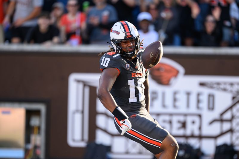 Sep 21, 2024; Corvallis, Oregon, USA; Oregon State Beavers linebacker Zakaih Saez (10) intercepts a pass for a touchdown during the first quarter against the Purdue Boilermakers at Reser Stadium. Mandatory Credit: Craig Strobeck-Imagn Images