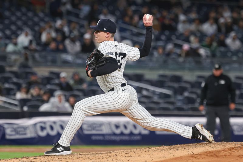 Apr 23, 2024; Bronx, New York, USA; New York Yankees relief pitcher Ron Marinaccio (97) delivers a pitch during the sixth inning against the Oakland Athletics at Yankee Stadium. Mandatory Credit: Vincent Carchietta-USA TODAY Sports