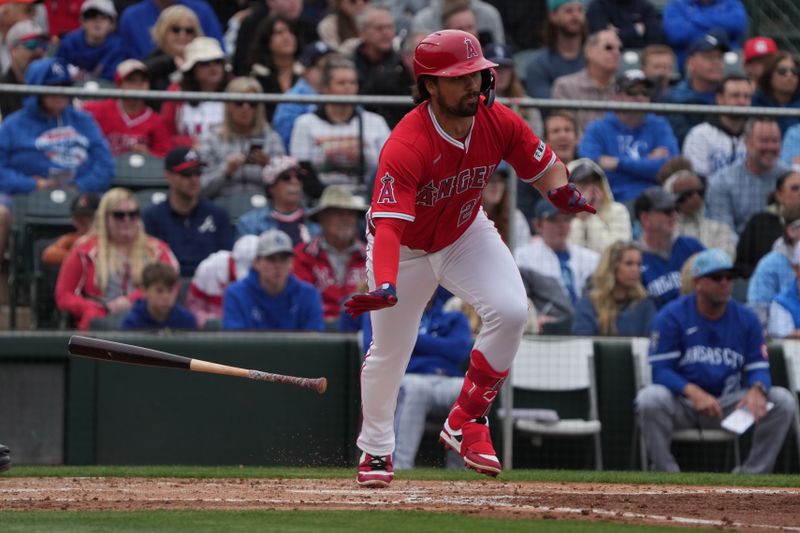 Mar 14, 2025; Tempe, Arizona, USA; Los Angeles Angels JD Davis hits a single against the Kansas City Royals in the third inning at Tempe Diablo Stadium. Mandatory Credit: Rick Scuteri-Imagn Images