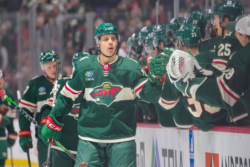 Nov 28, 2023; Saint Paul, Minnesota, USA; Minnesota Wild center Joel Eriksson Ek (14) celebrates his goal against the St. Louis Blues in the first period at Xcel Energy Center. Mandatory Credit: Brad Rempel-USA TODAY Sports