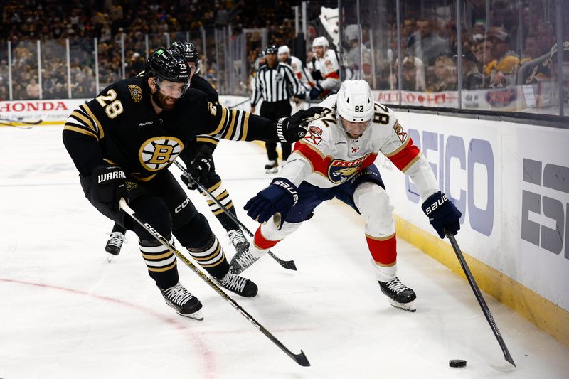 May 10, 2024; Boston, Massachusetts, USA; Florida Panthers center Kevin Stenlund (82) tries to get around Boston Bruins defenseman Derek Forbort (28) during the second period of game three of the second round of the 2024 Stanley Cup Playoffs at TD Garden. Mandatory Credit: Winslow Townson-USA TODAY Sports