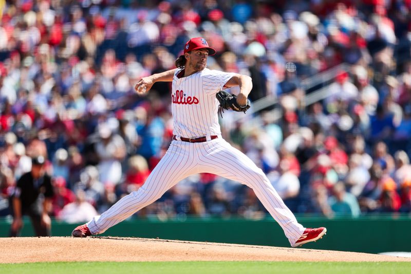 Feb 25, 2024; Clearwater, Florida, USA;  Philadelphia Phillies starting pitcher Aaron Nola (27) throws a pitch against the New York Yankees in the first inning at BayCare Ballpark. Mandatory Credit: Nathan Ray Seebeck-USA TODAY Sports