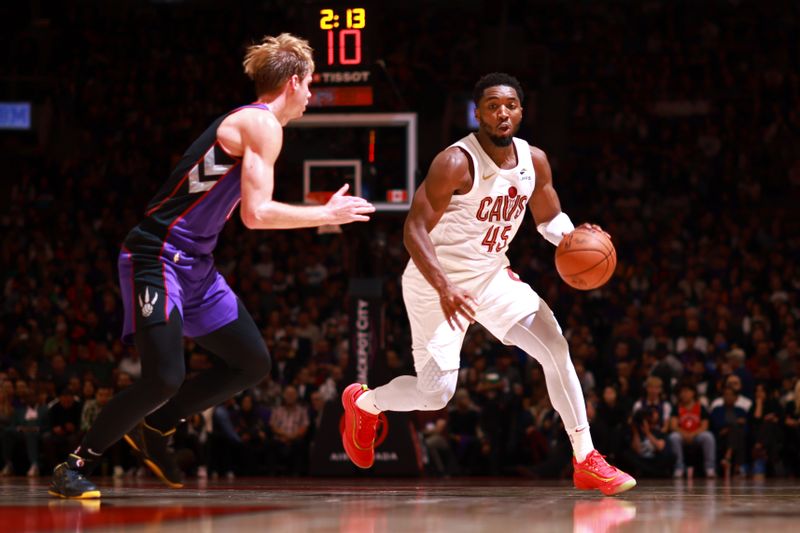 TORONTO, CANADA - OCTOBER 23: Donovan Mitchell #45 of the Cleveland Cavaliers handles the ball during the game against the Toronto Raptors on October 23, 2024 at the Scotiabank Arena in Toronto, Ontario, Canada.  NOTE TO USER: User expressly acknowledges and agrees that, by downloading and or using this Photograph, user is consenting to the terms and conditions of the Getty Images License Agreement.  Mandatory Copyright Notice: Copyright 2024 NBAE (Photo by Vaughn Ridley/NBAE via Getty Images)