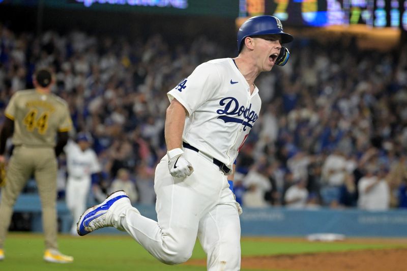 Sep 26, 2024; Los Angeles, California, USA;  Los Angeles Dodgers catcher Will Smith (16) celebrates after hitting a two-run home run off San Diego Padres starting pitcher Joe Musgrove (44) in the seventh inning at Dodger Stadium. Mandatory Credit: Jayne Kamin-Oncea-Imagn Images