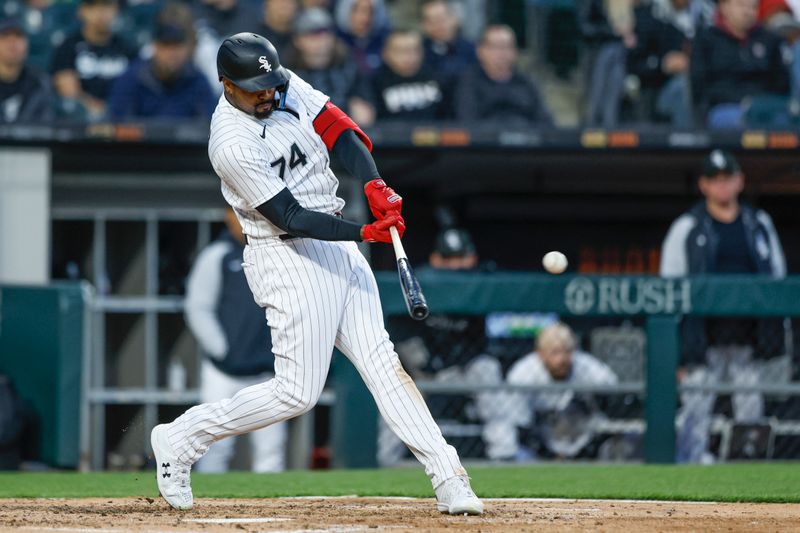 Apr 28, 2023; Chicago, Illinois, USA; Chicago White Sox designated hitter Eloy Jimenez (74) singles against the Tampa Bay Rays during the fifth inning at Guaranteed Rate Field. Mandatory Credit: Kamil Krzaczynski-USA TODAY Sports