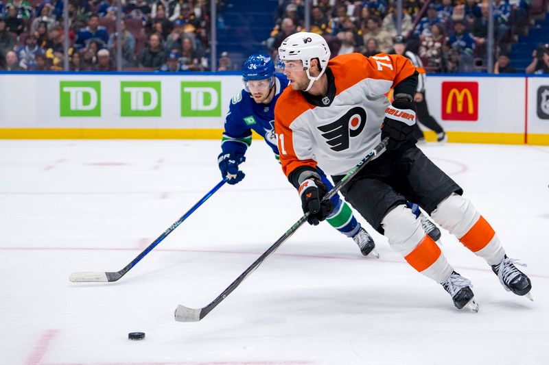 Oct 11, 2024; Vancouver, British Columbia, CAN; Vancouver Canucks forward Pius Suter (24) watches Philadelphia Flyers forward Tyson Foerster (71) handle the puck during the third period at Rogers Arena. Mandatory Credit: Bob Frid-Imagn Images