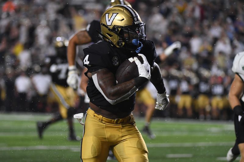 Aug 26, 2023; Nashville, Tennessee, USA; Vanderbilt Commodores running back Patrick Smith (4) runs for a touchdown during the first half against the Hawaii Warriors at FirstBank Stadium. Mandatory Credit: Christopher Hanewinckel-USA TODAY Sports