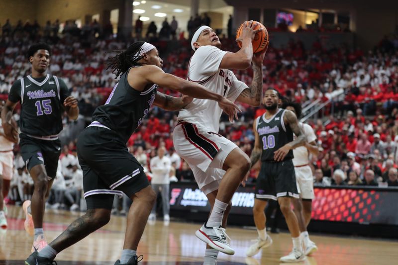 Feb 21, 2026; Lubbock, Texas, USA;   Texas Tech Red Raiders forward LeJuan Watts (3) goes to the basket against Kansas State Wildcats Nate Johnson (34) in the first half at United Supermarkets Arena. Mandatory Credit: Michael C. Johnson-Imagn Images