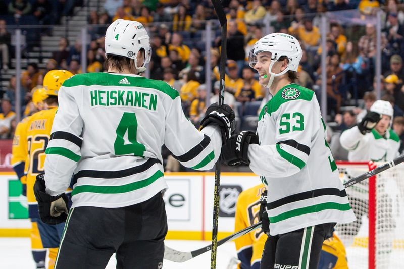 Feb 15, 2024; Nashville, Tennessee, USA; Dallas Stars defenseman Miro Heiskanen (4) celebrates his goal with center Wyatt Johnston (53) against the Nashville Predators during the second period at Bridgestone Arena. Mandatory Credit: Steve Roberts-USA TODAY Sports