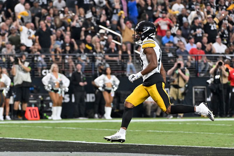 Pittsburgh Steelers wide receiver Calvin Austin III (19) scores a touchdown during the first half of an NFL football game against the Las Vegas Raiders Sunday, Sept. 24, 2023, in Las Vegas. (AP Photo/David Becker)