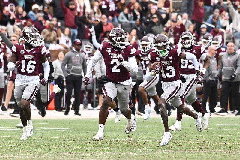 Nov 19, 2022; Starkville, Mississippi, USA; Mississippi State Bulldogs cornerback Emmanuel Forbes (13) returns an interception for a touchdown against the East Tennessee State Buccaneers during the second quarter at Davis Wade Stadium at Scott Field. Mandatory Credit: Matt Bush-USA TODAY Sports