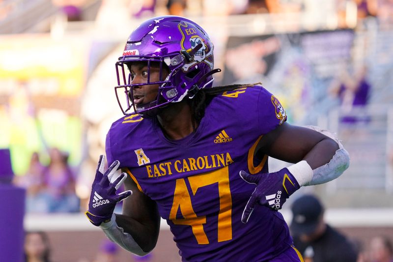 Oct 2, 2021; Greenville, North Carolina, USA;  East Carolina Pirates running back Rahjai Harris (47) celebrates after scoring a touchdown against the Tulane Green Wave during the second half at Dowdy-Ficklen Stadium. Mandatory Credit: James Guillory-USA TODAY Sports