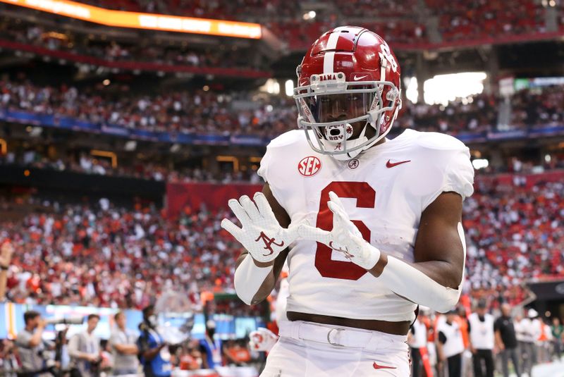 Sep 4, 2021; Atlanta, Georgia, USA;  Alabama Crimson Tide running back Trey Sanders (6) celebrates after scoring a touchdown against the Miami Hurricanes at Mercedes-Benz Stadium. Alabama won 44-13. Mandatory Credit: Gary Cosby-USA TODAY Sports