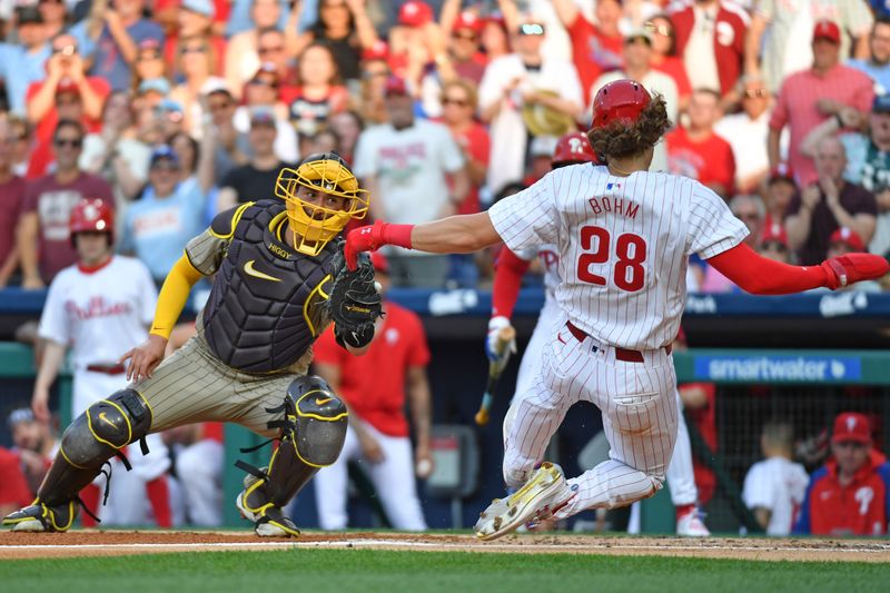 Jun 17, 2024; Philadelphia, Pennsylvania, USA; San Diego Padres catcher Kyle Higashioka (20) tags out Philadelphia Phillies third base Alec Bohm (28) at home during the second inning at Citizens Bank Park. Mandatory Credit: Eric Hartline-USA TODAY Sports