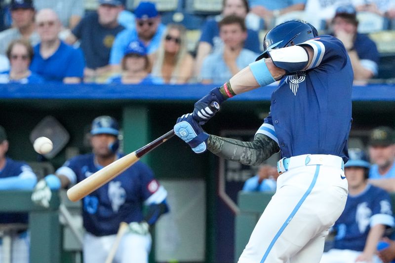 May 17, 2024; Kansas City, Missouri, USA; Kansas City Royals shortstop Bobby Witt Jr. (7) hits a double against the Oakland Athletics in the first inning at Kauffman Stadium. Mandatory Credit: Denny Medley-USA TODAY Sports