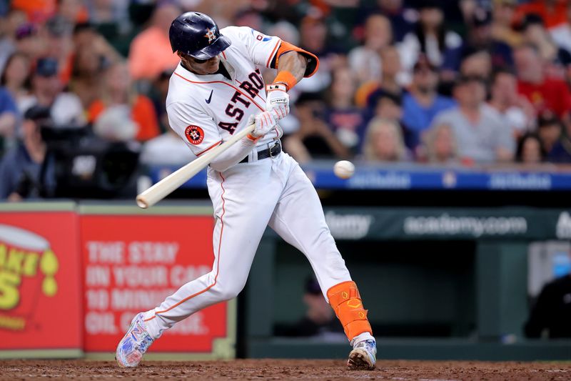 Jun 26, 2024; Houston, Texas, USA; Houston Astros shortstop Jeremy Pena (3) hits a single against the Colorado Rockies during the seventh inning at Minute Maid Park. Mandatory Credit: Erik Williams-USA TODAY Sports