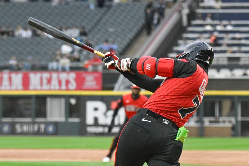 May 2, 2025; Chicago, Illinois, USA;  Chicago White Sox catcher Edgar Quero (7) hits an RBI double against the Houston Astros during the first inning at Rate Field. Mandatory Credit: Matt Marton-Imagn Images