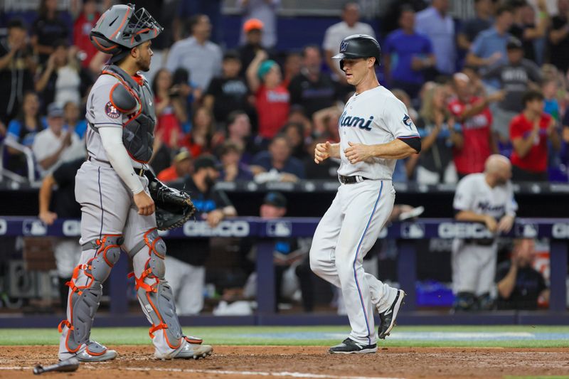 Aug 15, 2023; Miami, Florida, USA; Miami Marlins shortstop Joey Wendle (18) scores on a throwing error by Houston Astros starting pitcher Cristian Javier (not pictured) during the fifth inning at loanDepot Park. Mandatory Credit: Sam Navarro-USA TODAY Sports