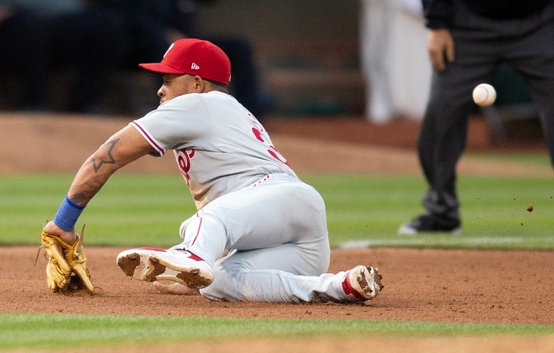 Jun 16, 2023; Oakland, California, USA; Philadelphia Phillies third baseman Edmundo Sosa (33) cannot make the play during the sixth inning at Oakland-Alameda County Coliseum. Ruiz ended up with a double. Mandatory Credit: D. Ross Cameron-USA TODAY Sports