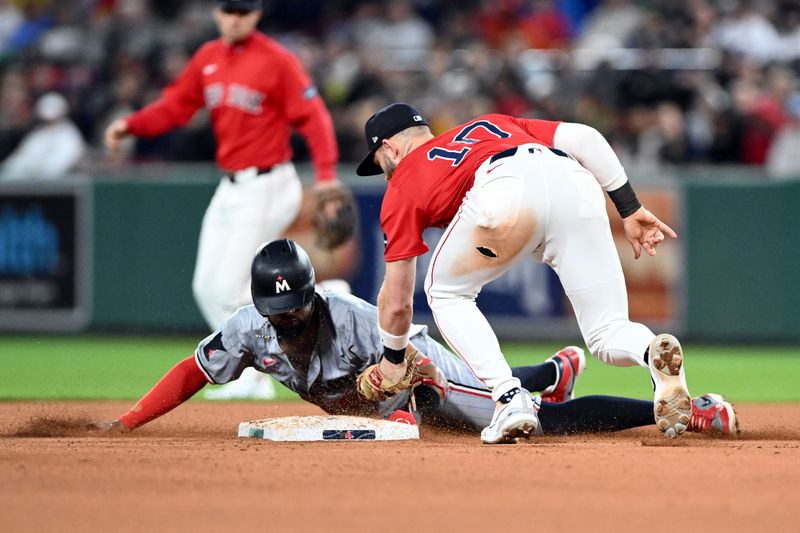 Sep 20, 2024; Boston, Massachusetts, USA; Boston Red Sox shortstop Trevor Story (10) tags out Minnesota Twins second baseman Willi Castro (50) during the eighth inning at Fenway Park. Mandatory Credit: Brian Fluharty-Imagn Images