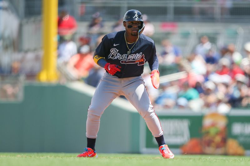 Mar 28, 2023; Fort Myers, Florida, USA;  Atlanta Braves right fielder Ronald Acuna Jr. (13) looks on from first base after hitting a single against the Boston Red Sox in the third inning during spring training at JetBlue Park at Fenway South. Mandatory Credit: Nathan Ray Seebeck-USA TODAY Sports