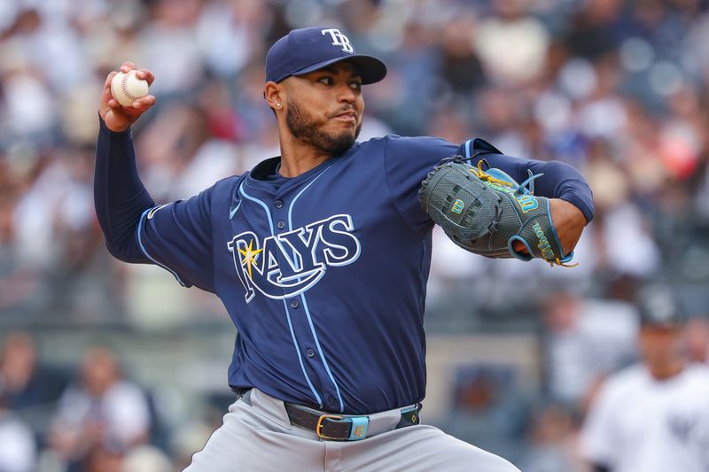 May 4, 2025; Bronx, New York, USA; Tampa Bay Rays starting pitcher Taj Bradley (45) delivers a pitch during the first inning against the New York Yankees at Yankee Stadium. Mandatory Credit: Vincent Carchietta-Imagn Images