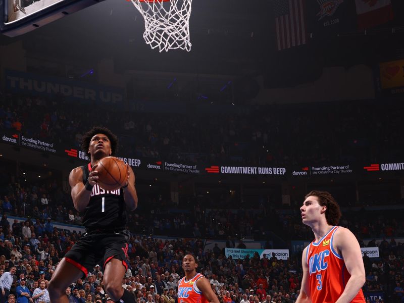 OKLAHOMA CITY, OK - MARCH 27:  Amen Thompson #1 of the Houston Rockets drives to the basket during the game against the Oklahoma City Thunder on March 27, 2024 at Paycom Arena in Oklahoma City, Oklahoma. NOTE TO USER: User expressly acknowledges and agrees that, by downloading and or using this photograph, User is consenting to the terms and conditions of the Getty Images License Agreement. Mandatory Copyright Notice: Copyright 2024 NBAE (Photo by Zach Beeker/NBAE via Getty Images)