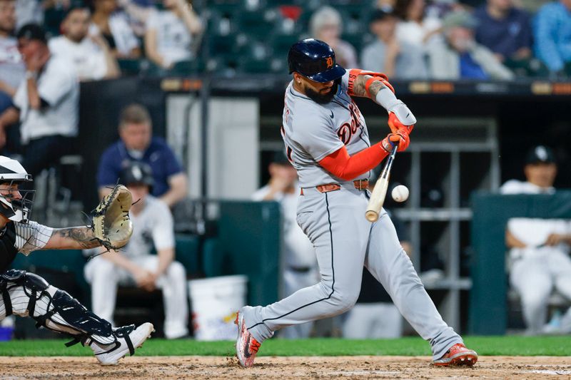 Jun 2, 2025; Chicago, Illinois, USA; Detroit Tigers second baseman Gleyber Torres (25) hits an RBI-ground out against the Chicago White Sox during the sixth inning at Rate Field. Mandatory Credit: Kamil Krzaczynski-Imagn Images