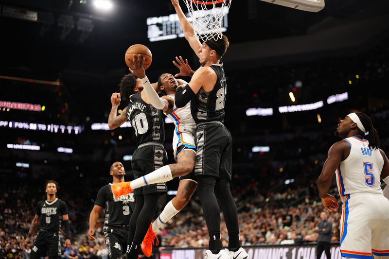 SAN ANTONIO, TX - NOVEMBER 19: Jalen Williams #8 of the Oklahoma City Thunder drives to the basket during the game against the San Antonio Spurs during the Emirates NBA Cup game on November 19, 2024 at the Frost Bank Center in San Antonio, Texas. NOTE TO USER: User expressly acknowledges and agrees that, by downloading and or using this photograph, user is consenting to the terms and conditions of the Getty Images License Agreement. Mandatory Copyright Notice: Copyright 2024 NBAE (Photos by Darren Carroll/NBAE via Getty Images)