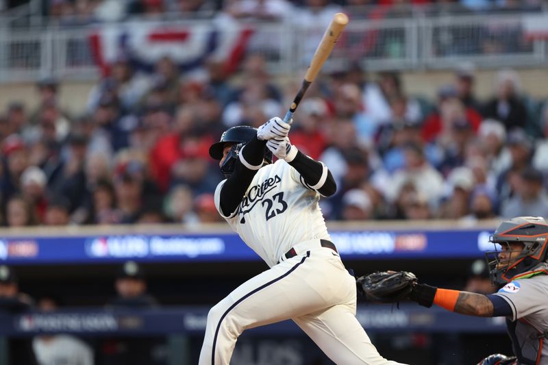 Oct 11, 2023; Minneapolis, Minnesota, USA; Minnesota Twins third baseman Royce Lewis (23) hits a solo home-run in the first inning against the Houston Astros  during game four of the ALDS for the 2023 MLB playoffs at Target Field. Mandatory Credit: Jesse Johnson-USA TODAY Sports