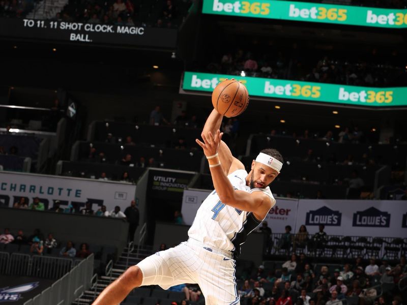 CHARLOTTE, NC - MARCH 5: Jalen Suggs #4 of the Orlando Magic handles the ball during the game against the Charlotte Hornets on March 5, 2024 at Spectrum Center in Charlotte, North Carolina. NOTE TO USER: User expressly acknowledges and agrees that, by downloading and or using this photograph, User is consenting to the terms and conditions of the Getty Images License Agreement. Mandatory Copyright Notice: Copyright 2024 NBAE (Photo by Kent Smith/NBAE via Getty Images)