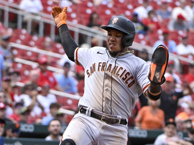 Jun 14, 2023; St. Louis, Missouri, USA;  San Francisco Giants second baseman Thairo Estrada (39) slides in safely at home plate during the tenth inning against the St. Louis Cardinals at Busch Stadium. Mandatory Credit: Jeff Curry-USA TODAY Sports