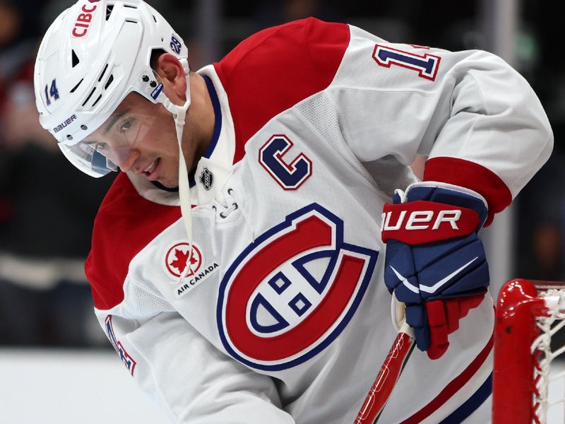 Mar 6, 2026; Anaheim, California, USA;  Montreal Canadiens center Nick Suzuki (14) warms up before the game against the Anaheim Ducks at Honda Center. Mandatory Credit: Kiyoshi Mio-Imagn Images