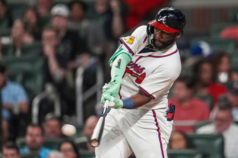 Sep 4, 2024; Cumberland, Georgia, USA; Atlanta Braves outfielder Michael Harris II (23) hits a double against the Colorado Rockies during the sixth inning at Truist Park. Mandatory Credit: Dale Zanine-Imagn Images