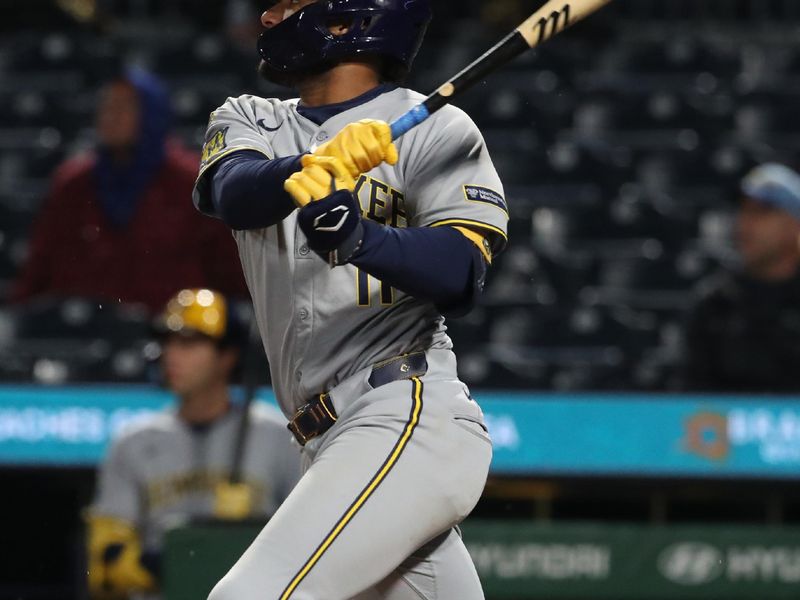 May 22, 2025; Pittsburgh, Pennsylvania, USA;  Milwaukee Brewers center fielder Jackson Chourio (11) hits a double against the Pittsburgh Pirates during the eighth inning at PNC Park. Mandatory Credit: Charles LeClaire-Imagn Images