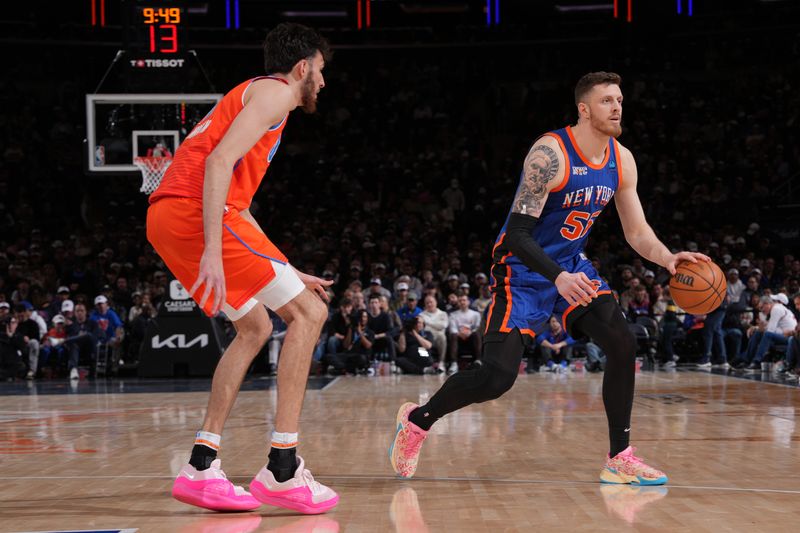 NEW YORK, NY - MARCH 31: Isaiah Hartenstein #55 of the New York Knicks dribbles the ball during the game against the Oklahoma City Thunder on March 31, 2024 at Madison Square Garden in New York City, New York.  NOTE TO USER: User expressly acknowledges and agrees that, by downloading and or using this photograph, User is consenting to the terms and conditions of the Getty Images License Agreement. Mandatory Copyright Notice: Copyright 2024 NBAE  (Photo by Jesse D. Garrabrant/NBAE via Getty Images)