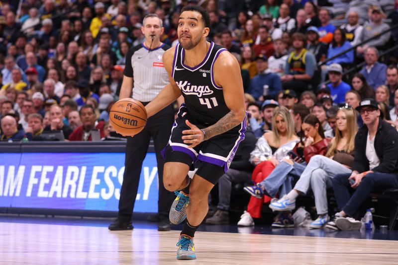 DENVER, COLORADO - FEBRUARY 28: Trey Lyles #41 of the Sacramento Kings dribbles the ball towards the basket during the game against the Denver Nuggets at Ball Arena on February 28, 2024 in Denver, Colorado. NOTE TO USER: User expressly acknowledges and agrees that, by downloading and or using this photograph, User is consenting to the terms and conditions of the Getty Images License Agreement. (Photo by Alysa Rubin/Clarkson Creative/Getty Images)