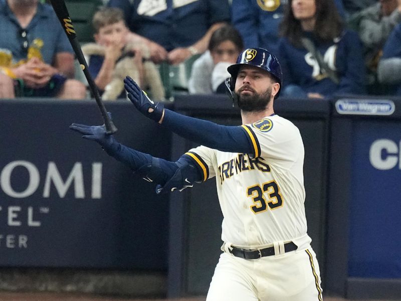 May 24, 2023; Milwaukee, Wisconsin, USA; Milwaukee Brewers designated hitter Jesse Winker (33) watch this fly ball during the seventh inning of their game against the Houston Astros at American Family Field. Mandatory Credit: Mark Hoffman-USA TODAY Sports