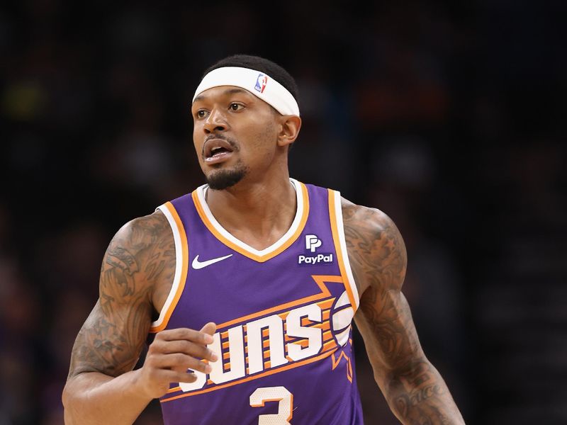 PHOENIX, ARIZONA - DECEMBER 12: Bradley Beal #3 of the Phoenix Suns handles the ball during the first half of the NBA game against the Golden State Warriors at Footprint Center on December 12, 2023 in Phoenix, Arizona.  The Suns defeated the Warriors 119-116. NOTE TO USER: User expressly acknowledges and agrees that, by downloading and or using this photograph, User is consenting to the terms and conditions of the Getty Images License Agreement.  (Photo by Christian Petersen/Getty Images)